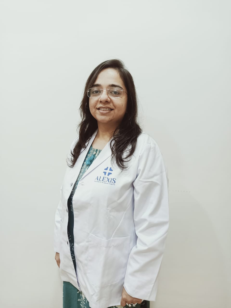 Dr sanjana sainani with white apron image